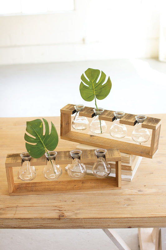 FOUR GLASS BUD VASES WITH A RECYCLED WOODEN STAND