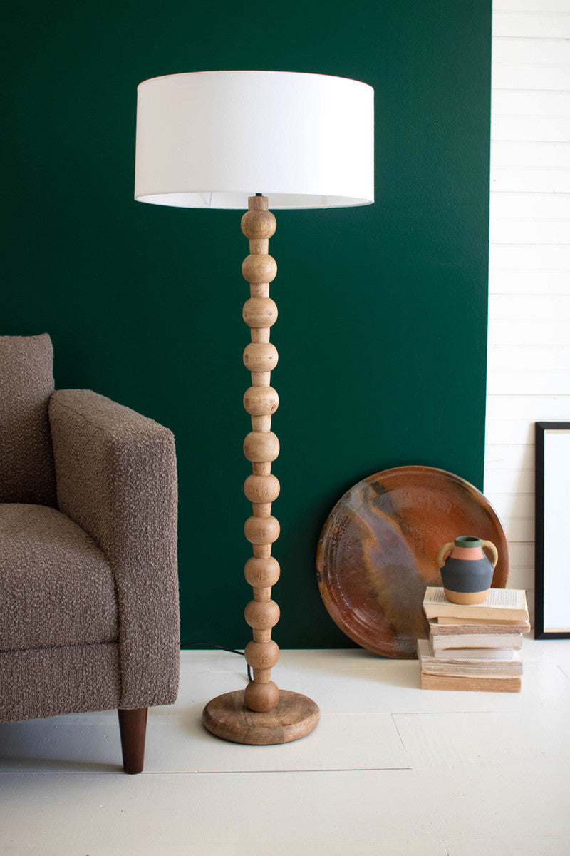 CARVED WOODEN FLOOR LAMP WITH OFF-WHITE BARREL SHADE